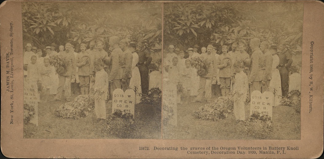 Decorating the graves of the Oregon Volunteers in Battery Knoll Cemetery, Decoration Day, 1899, Manila, P. I.